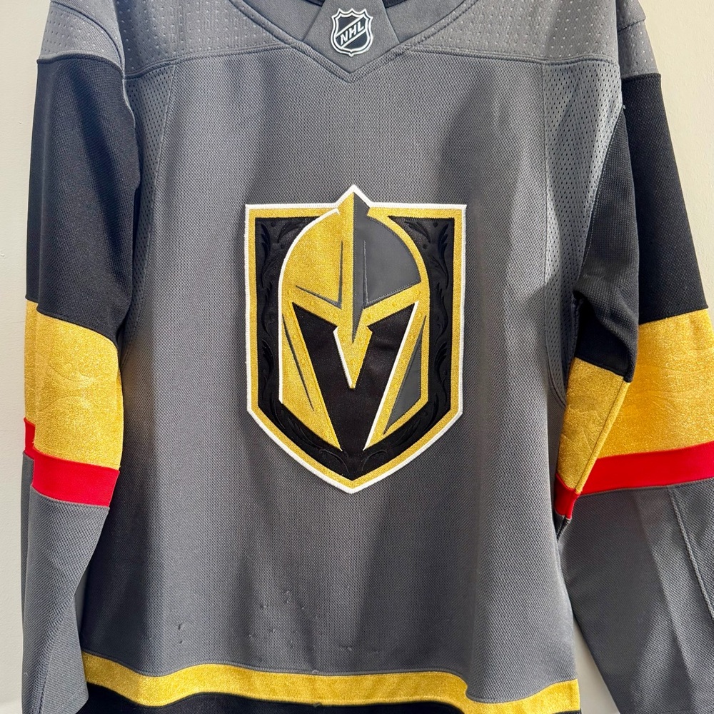 NHL Gray Jersey with Gold and Red Accents